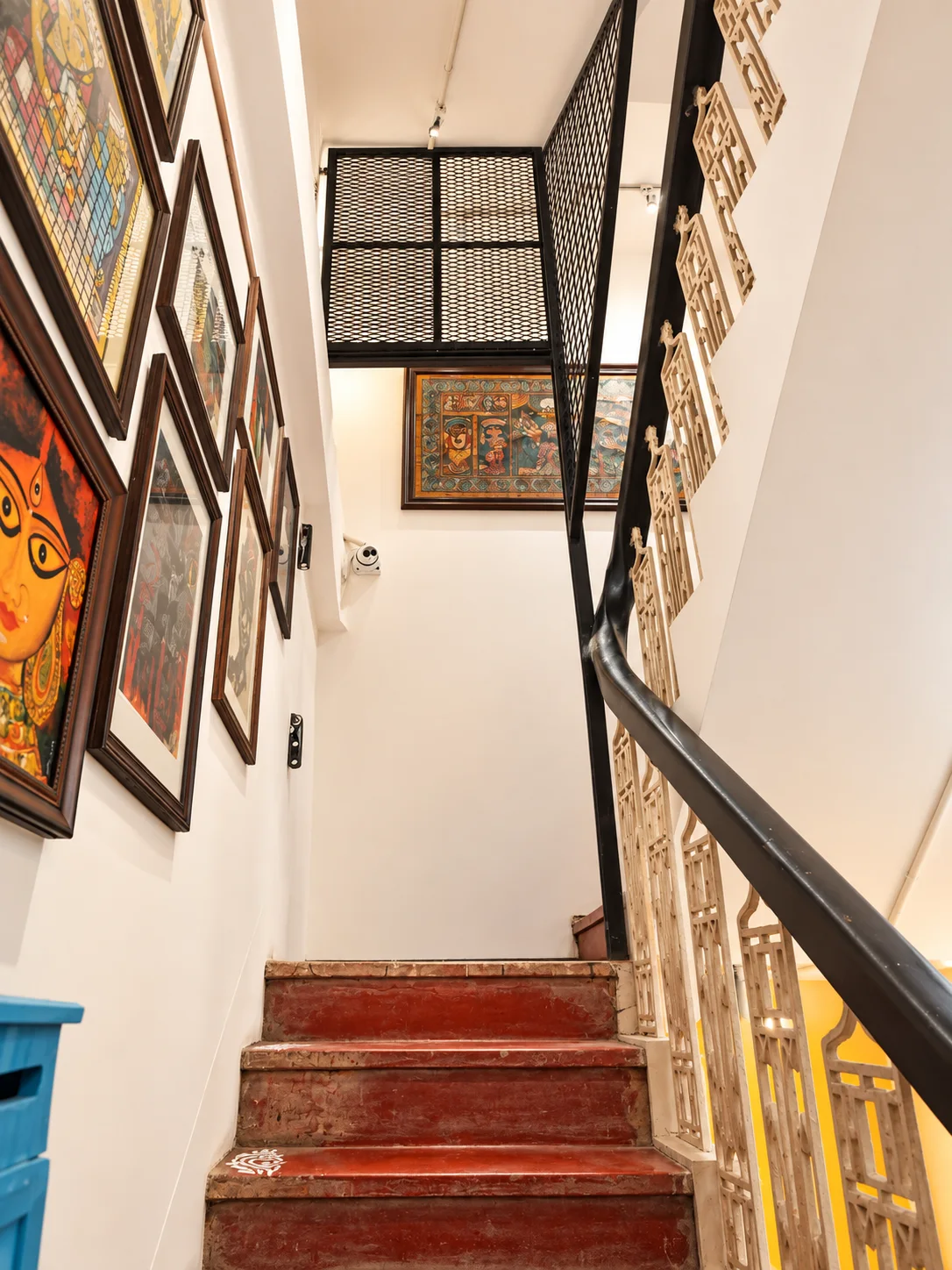 Art-lined stairwell at The Turquoise Letterbox
